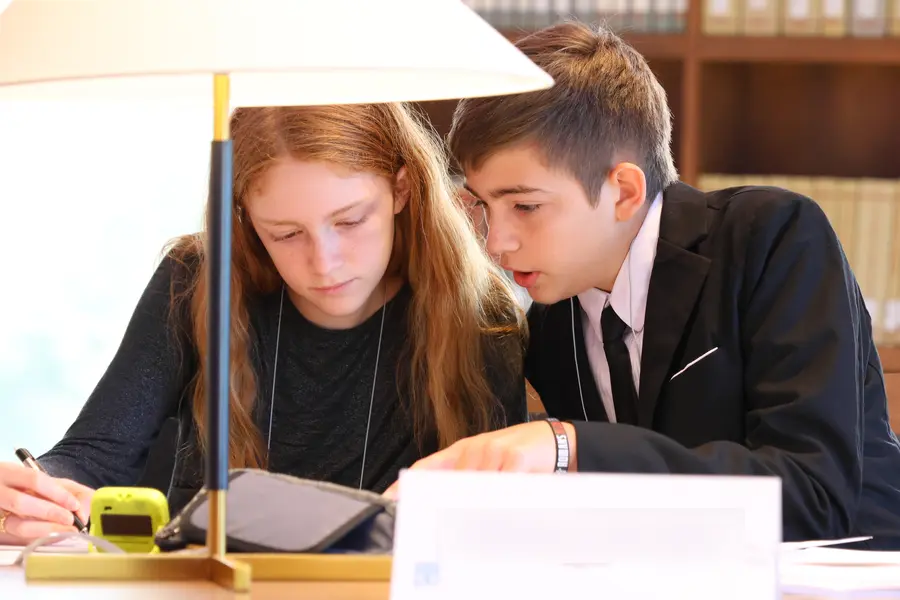 Wavemakers students collaborating at the debate table