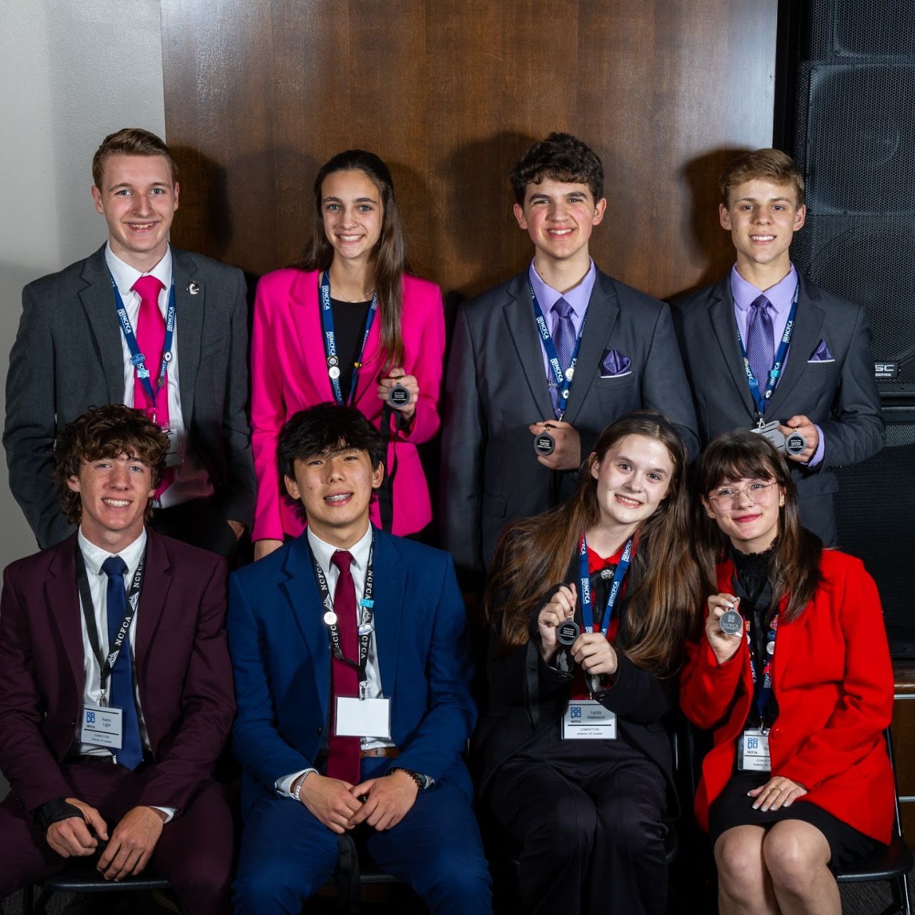 Wavemakers students displaying medals at a national tournament
